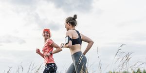 Two women running in the countryside