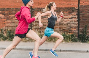 two women running on the street