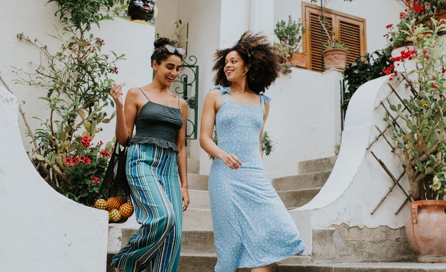 two young woman leave a holiday villa
