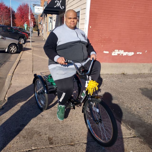 Ty Burch receives a new bicycle from his community
