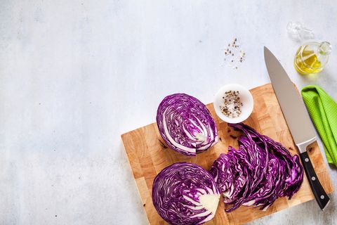 chef knife on a cutting board and vegetables purple cabbage cooking food background copy space