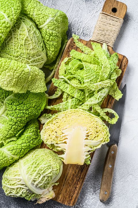sliced savoy cabbage from organic grower farm white background top view