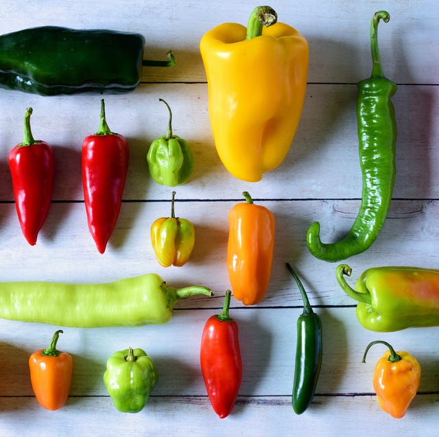 large assortment of fresh peppers from mild bell peppers to jalapeno, serrano, and habanero