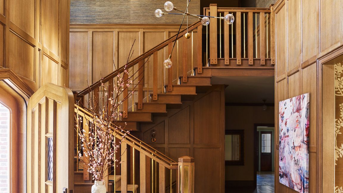 slim brass spindles support the handrail of this oak staircase by designer gideon mendelson and architect ned stoll