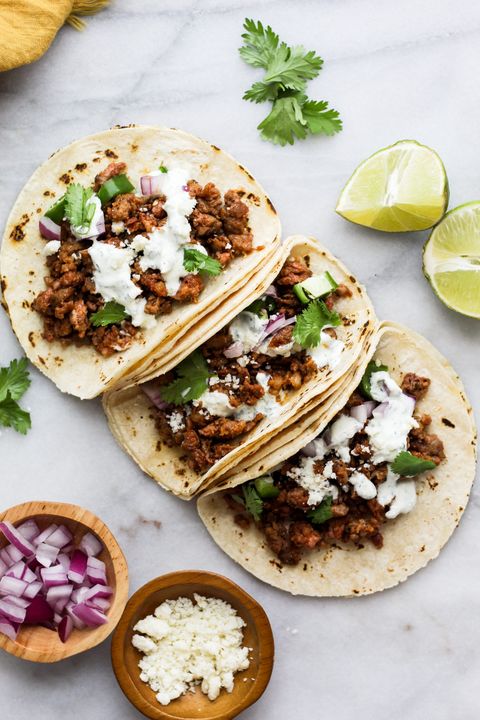chorizo tacos with crema, threre tacos with red onion on side
