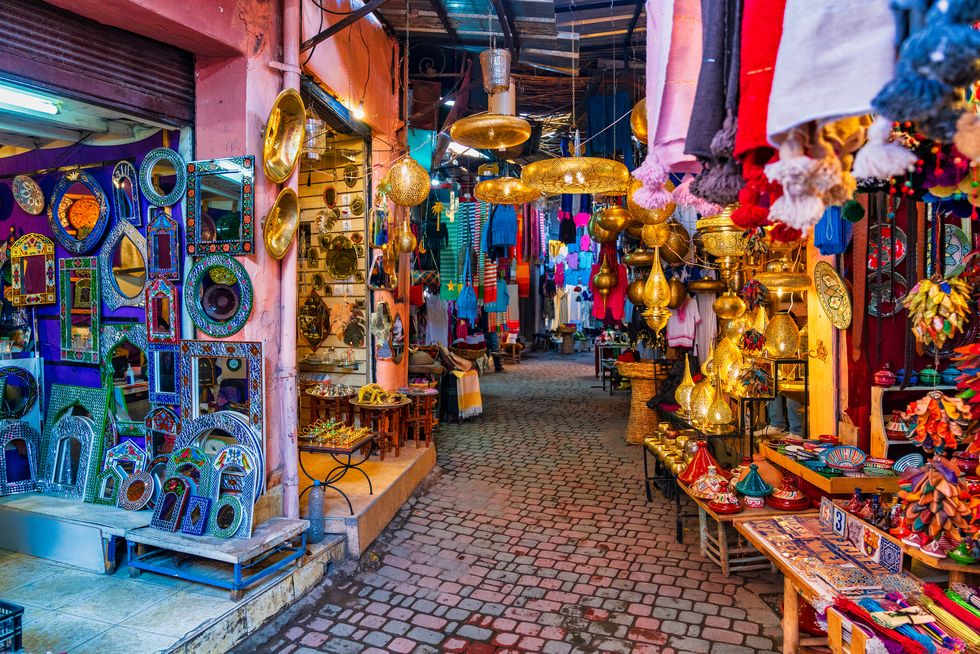 typical souk market in the medina of marrakech, morocco