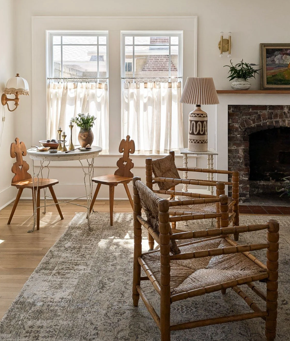 cozy living space with a table chairs and decorative elements