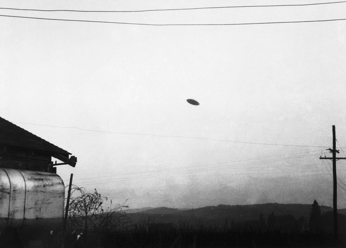 original caption 5111950 minnville, or a picture of a flying saucer photographed by farmer paul trent shown flying over his farm