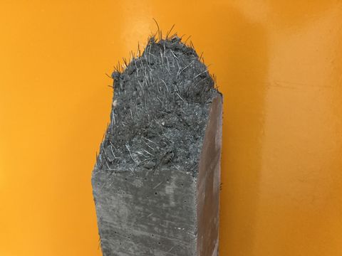 close up of a sample of ultra high performance concrete reinforced with fibers