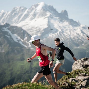 a group of people running on a mountain a group of people running on a mountain