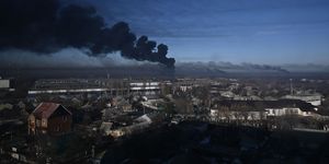 topshot   black smoke rises from a military airport in chuguyev near kharkiv  on february 24, 2022   russian president vladimir putin announced a military operation in ukraine today with explosions heard soon after across the country and its foreign minister warning a "full scale invasion" was underway photo by aris messinis  afp photo by aris messinisafp via getty images