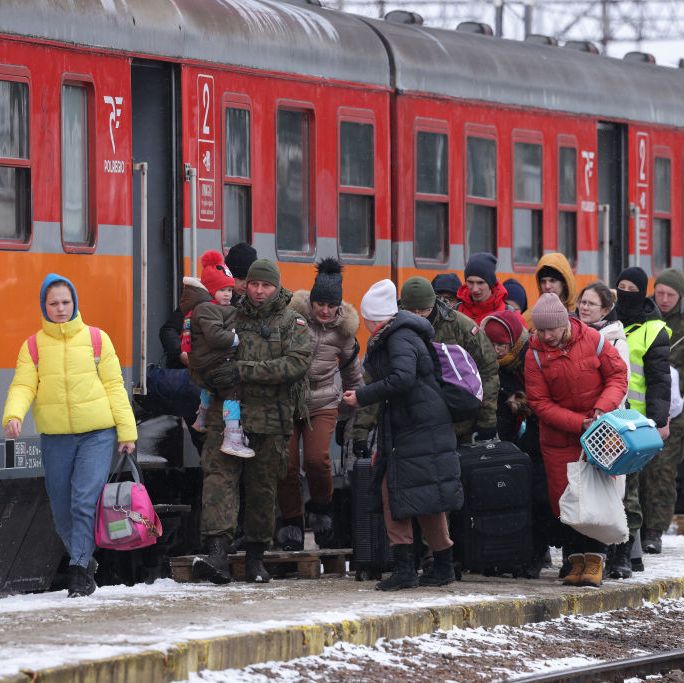 medyka, poland   march 09 polish soldiers assist people, mostly women and children, board a train following their arrival from war torn ukraine on a snowy day at the medyka border crossing on march 09, 2022 in medyka, poland over one million people have arrived in poland from ukraine since the russian invasion of february 24, and while many are now living with relatives who live and work in poland, others are journeying onward to other countries in europe  photo by sean gallupgetty images