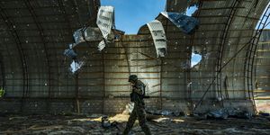 a ukrainian soldier walks inside a destroyed barn by russian shelling near the frontline of the zaporizhzhia province, ukraine harvest can not be collected in the area because the constant combats between russian and ukrainian armies in the fields photo by celestino arcenurphoto