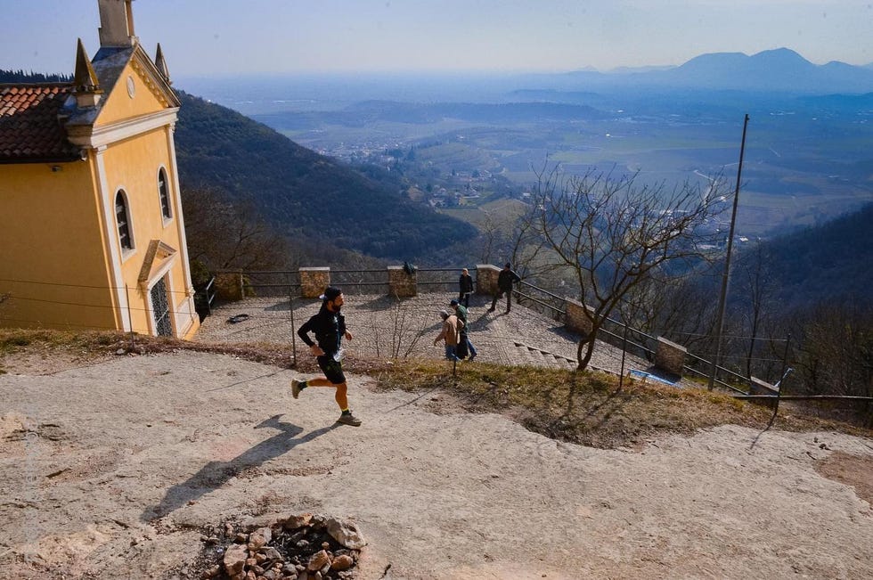 a person running on a dirt road