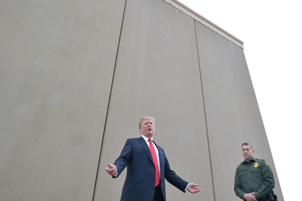 us president donald trump inspects border wall prototypes with chief patrol agent rodney s scott in san diego, california on march 13, 2018  afp photo  mandel ngan        photo credit should read mandel nganafp via getty images