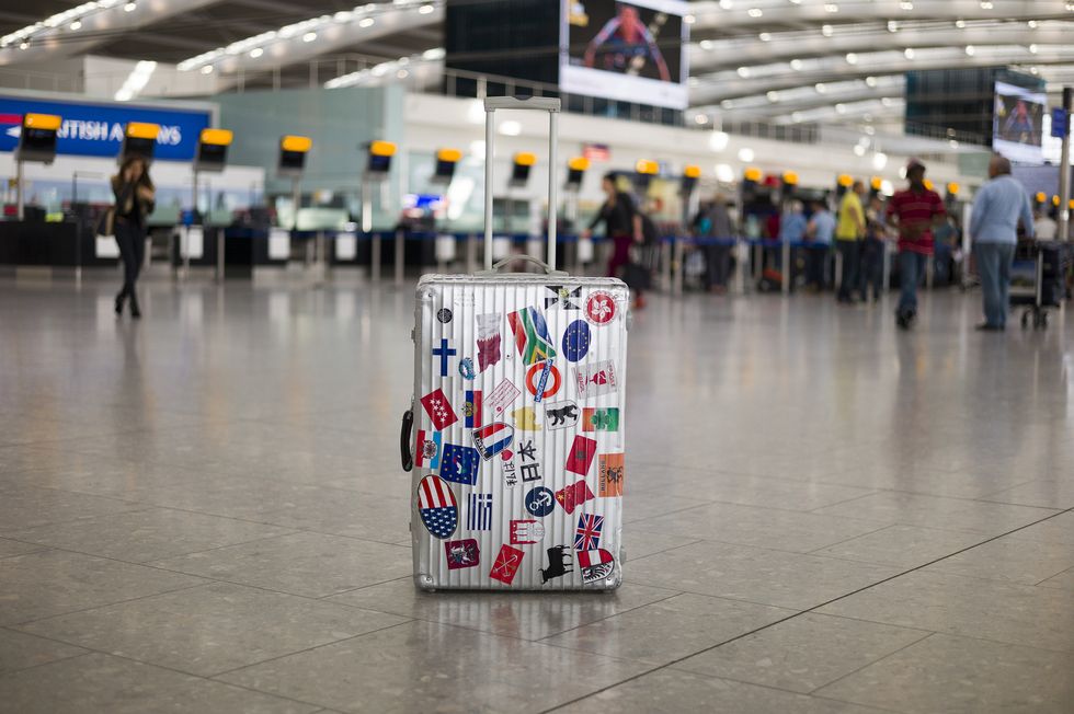 Unattended suitcase in departure zone at airport