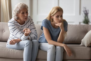 unhappy woman grandkid getting distracted from scolding grandma avoiding conflict