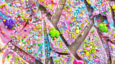 multicolored unicorn chocolate bark covered in sprinkles
