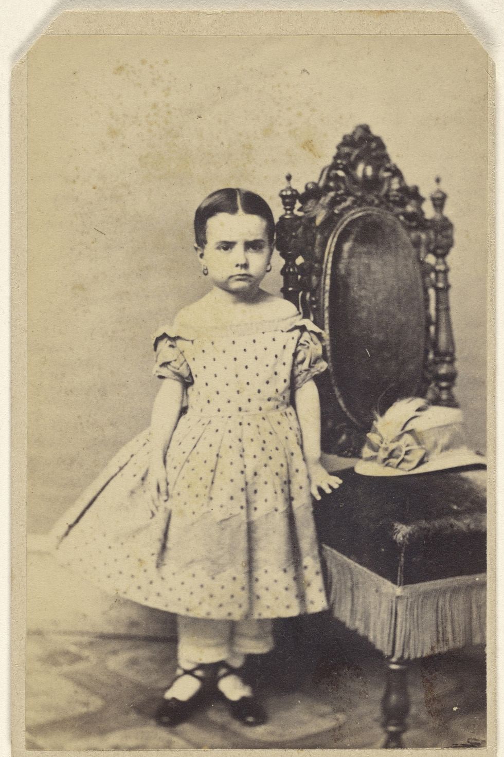 unidentified little girl wearing a polka dot dress