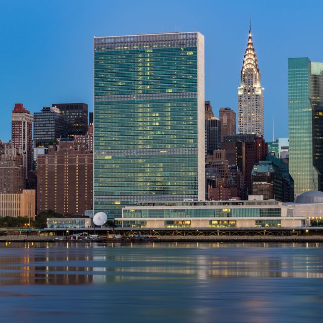 united nations headquarters across east river during dawn