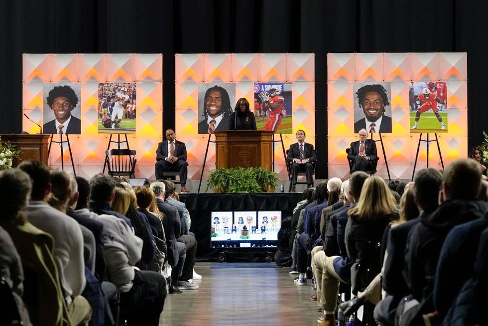 memorial held for university of virginia football players killed in shooting on sunday night