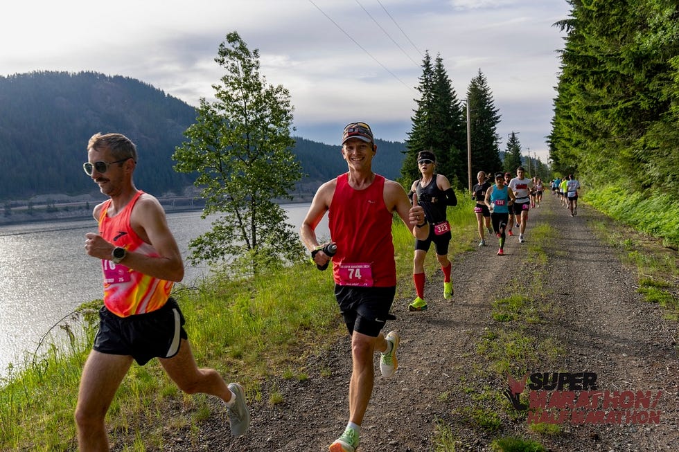 runners participating in an outdoor marathon along a scenic route super marathon