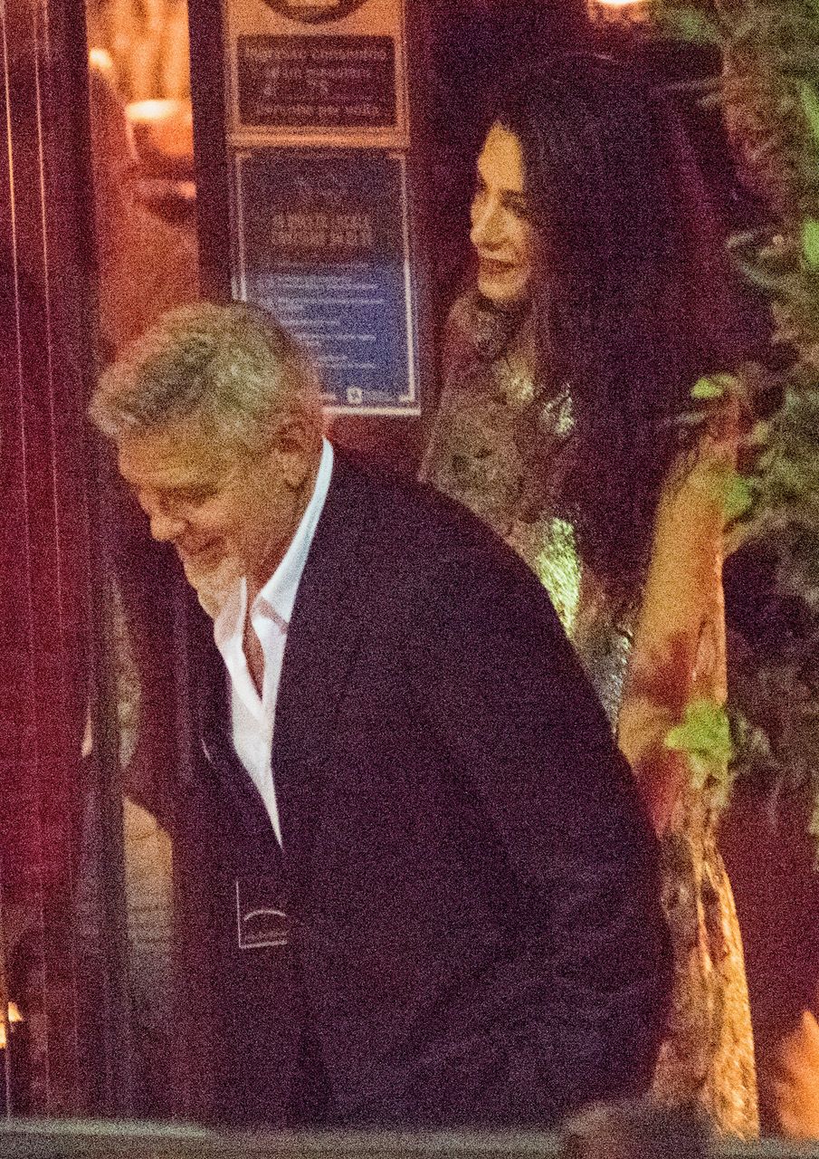 exclusive cernobbio lake como amal and george clooney spotted having a dinner date at gatto nero restaurant with an other couple the clooneys looked very relaxed, happy and accomplices with gorgeous amal wearing a shining gold mini dress and george who didn't miss to thank and kindly greetinging the owners of the restaurant 30 jul 2021 pictured amal alamuddin, george clooney photo credit mega themegaagencycom 1 888 505 6342