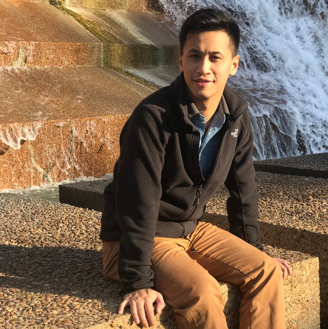 wayne tan sitting down next to a waterfall wayne tan sitting down next to a waterfall