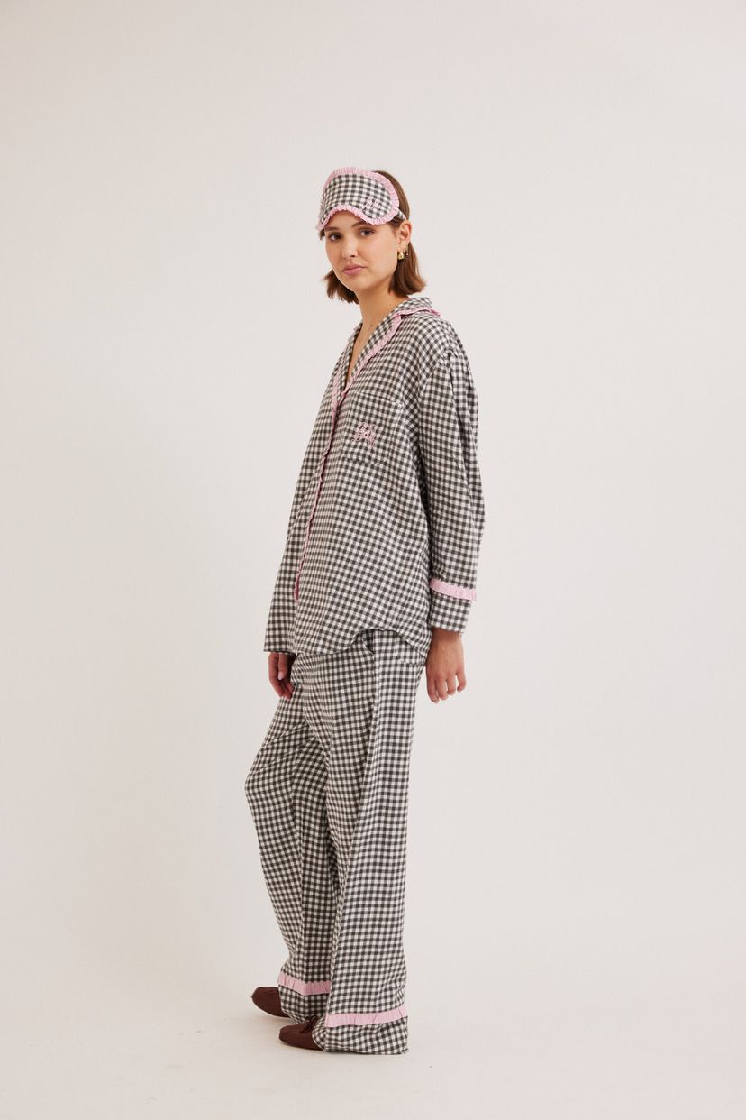 woman wearing gingham pyjamas