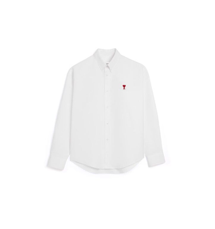 a white shirt with a red button