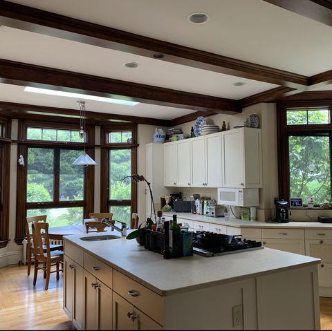 white kitchen with brown trim