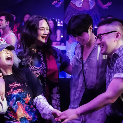 a lively social gathering in a nightlife setting with people interacting and enjoying themselves a lively social gathering in a nightlife setting with people interacting and enjoying themselves