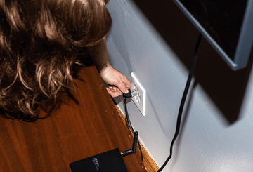 unplugging a cord from an outlet