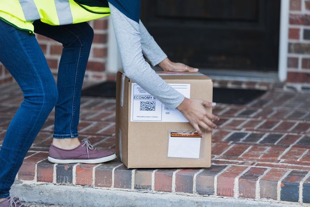 Unrecognizable Delivery Person Picking Up Or Royalty Free Image 1675895946 ?resize=640 *