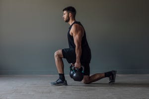 unrecognizable man exercising with kettlebells, cross training concept, a close up