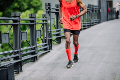 unrecognizable senior african american man running in a city