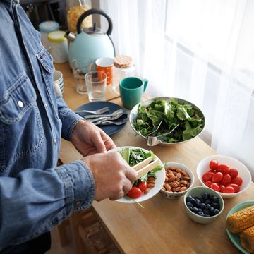 unrecognizable senior man preparing healthy breakfast at home
