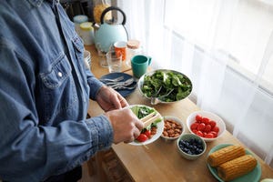 unrecognizable senior man preparing healthy breakfast at home