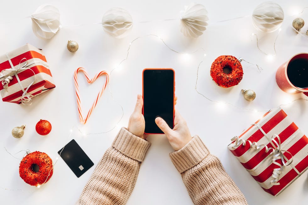 unrecognizable woman using mobile phone app for online shopping