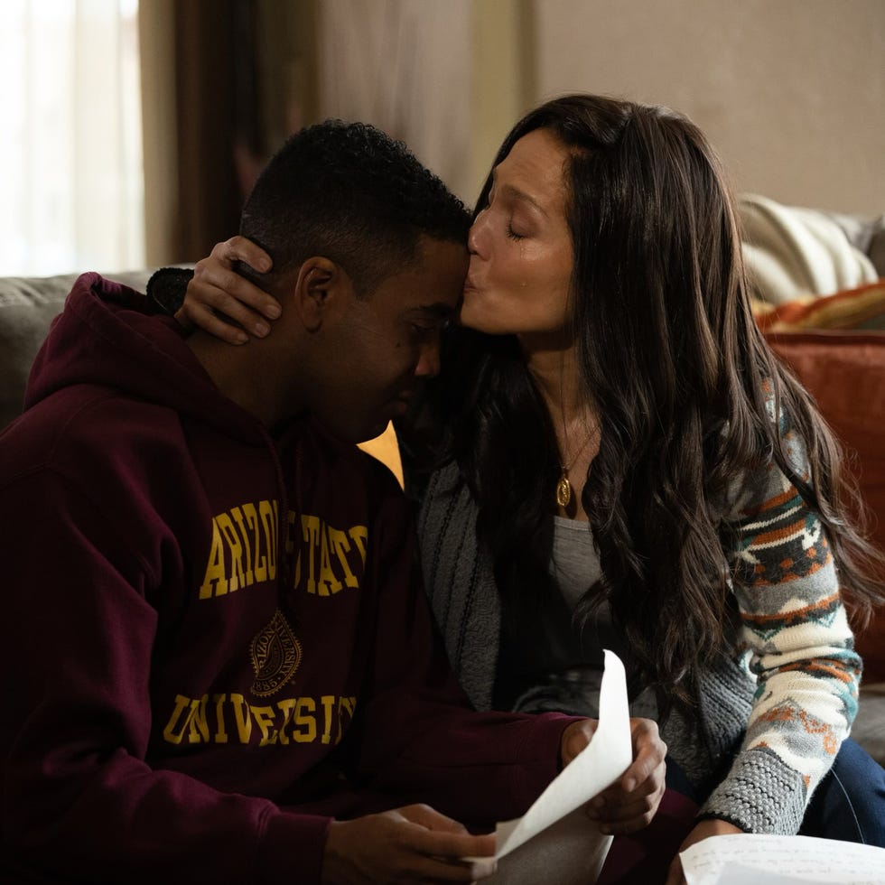 A couple sharing an intimate moment on a couch A couple sharing an intimate moment on a couch