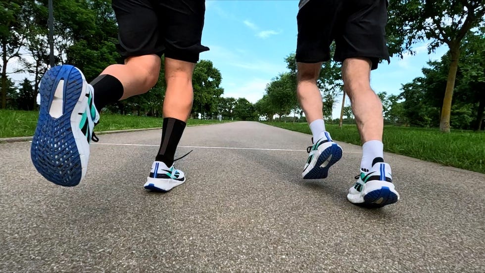 a pair of legs with exercise shoes