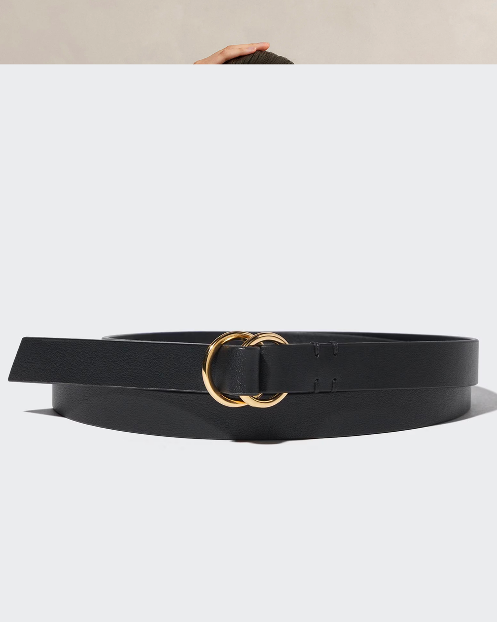 a black belt with a gold ring