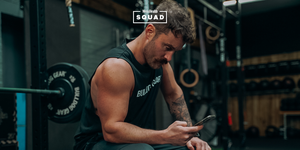 man in gym on phone