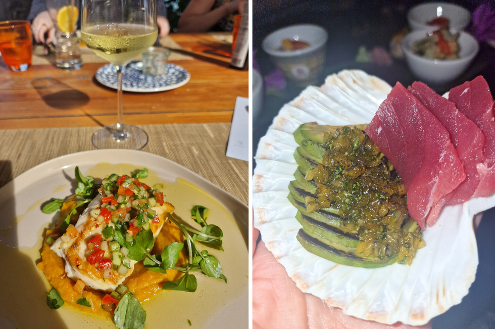 a plate of food and glasses of wine on a table