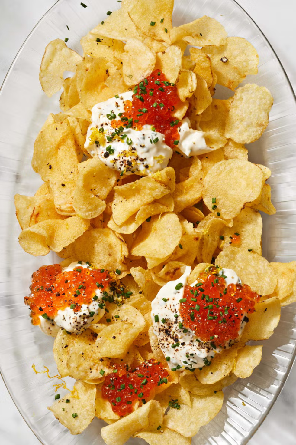 chips with creme fraiche and roe on top
