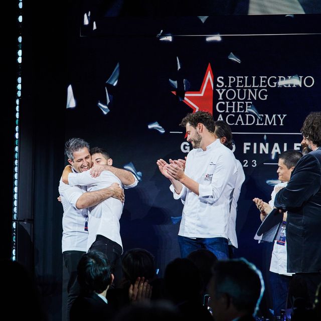 contestants hug the winning chef