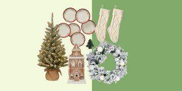 decorative holiday items including a christmas tree plates stockings a gingerbread house and a wreath