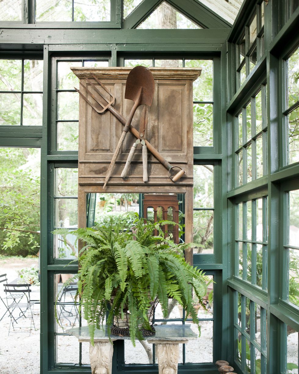 mirror decorated with vintage garden tools