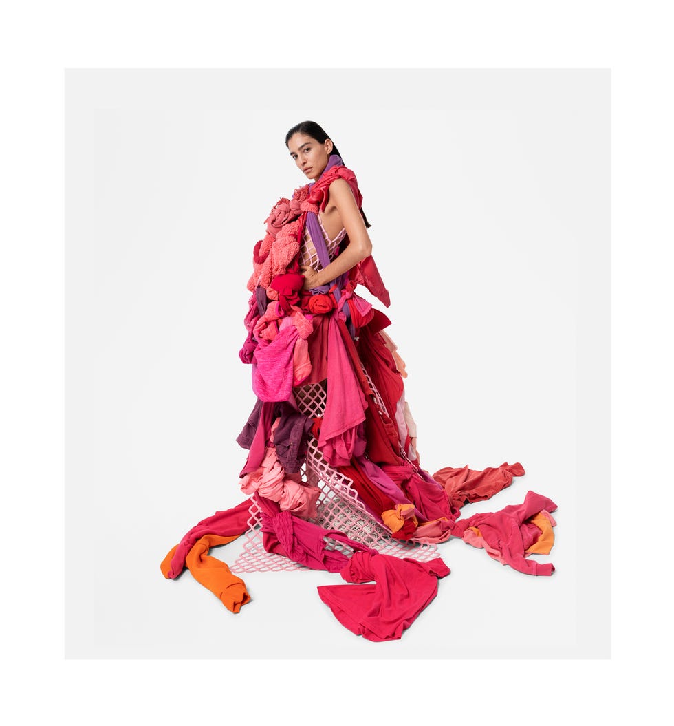 creative fashion design featuring a garment made of various pink and red fabrics