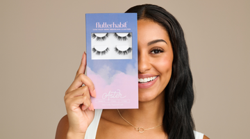 model holding a lash product displaying fauxmink eyelashes